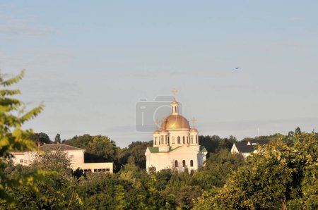 Photo for Church, very early in the morning, against the blue sky. - Royalty Free Image