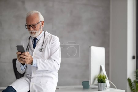 Photo for Online doctor appointment.Shot of senior male doctor working online consultation. - Royalty Free Image