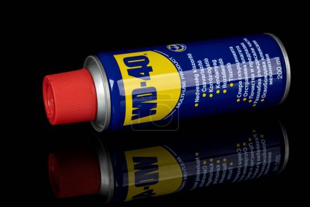 Photo for VARNA, BULGARIA - MAY 19, 2022: WD-40 on black background. Multi use product protects metal from rust and corrosion - Royalty Free Image