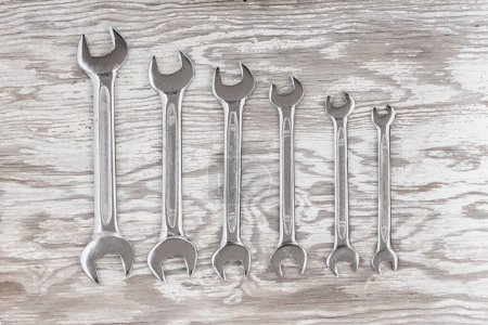 Photo for Spanners. Many wrenches. Industrial background. Set of wrench tool equipment on wooden background. - Royalty Free Image
