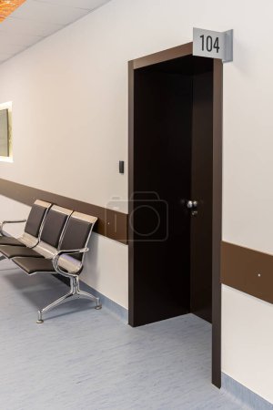 Photo for Waiting stainless steel chairs in waiting area. Hospital interior. Nobody. - Royalty Free Image