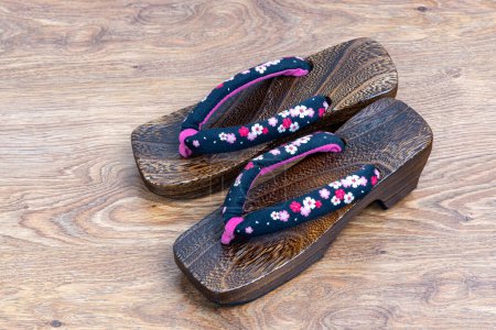 Photo for Japanese traditional geta sandal on wooden floor. Traditional Japanese asian wood footwear called Geta - Royalty Free Image