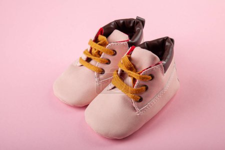 Photo for Pink baby shoes on pink background. Fashion for kids background concept. - Royalty Free Image
