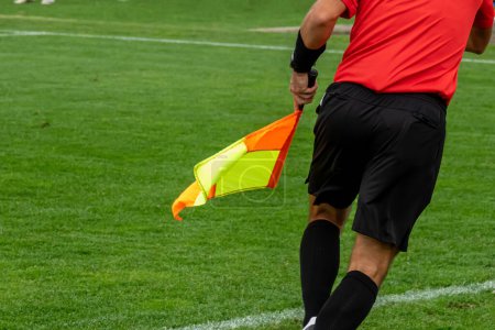 Photo for Assistant referees in action during a soccer match - Royalty Free Image