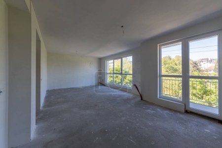 Photo for New empty room under construction. Plaster walls. New home. Concrete walls. Interior renovation. - Royalty Free Image
