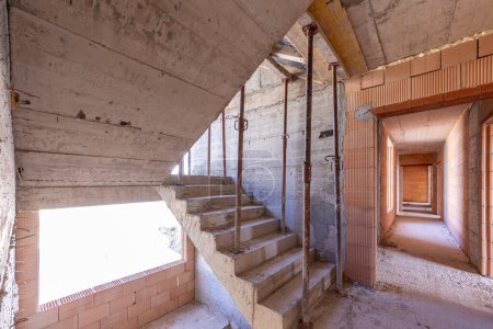 Photo for Unfinished concrete staircases on a buiiliding site. Construction. Unfinished building. Stair hall - Royalty Free Image