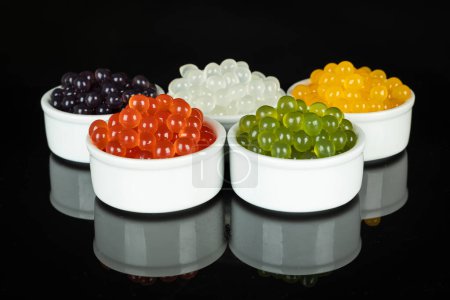 Photo for Different tapioca pearls for bubble tea. Bubble tea ingredients arrangement in bowls - Royalty Free Image