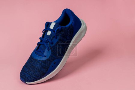 Photo for Running sports shoe on pink background. Running shoe, sneaker or trainer. Men's athletic shoe. fitness, sport, training concept. - Royalty Free Image