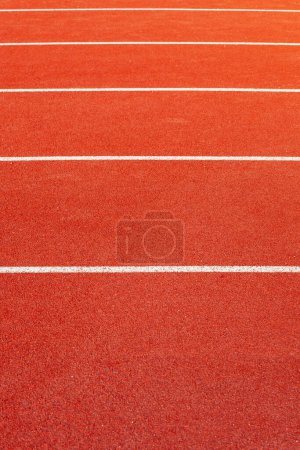 Photo for Red athletic  running track in stadium. Rubber coating. - Royalty Free Image