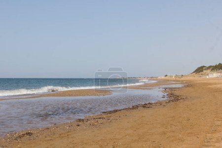 Photo for Sand on the sea coast in Turkey. Texture of beige sand on a sunny day can be used for background - Royalty Free Image