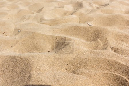 Photo for Sand on the sea coast in Turkey. Texture of beige sand on a sunny day can be used for background - Royalty Free Image