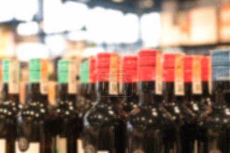 Photo for Blur liquor store background. Many blurred bottles with alcohol. Wine bottles background with copy space - Royalty Free Image