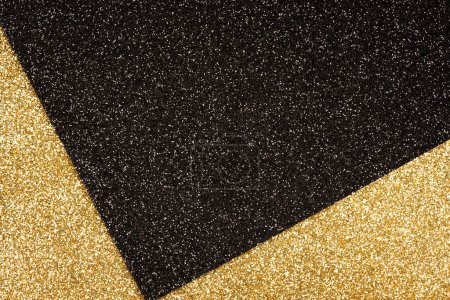 Photo for Luxury abstract glitter background in golden and black colours with copy space. Minimal fashionable style backdrop. Festive background - Royalty Free Image