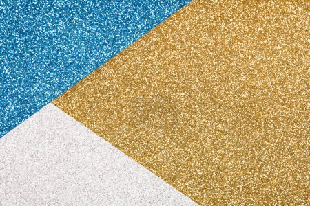 Photo for Festive glitter background in golden, blue and silver colours with copy space. Minimal fashionable style backdrop. Luxury background - Royalty Free Image
