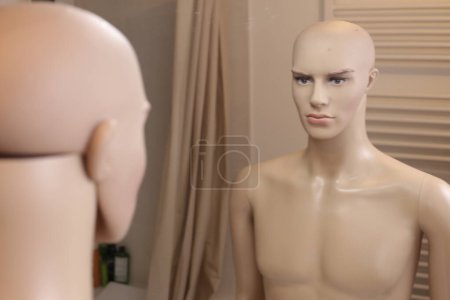 Photo for Close-up shot of mannequin in mask in front of mirror at home - Royalty Free Image