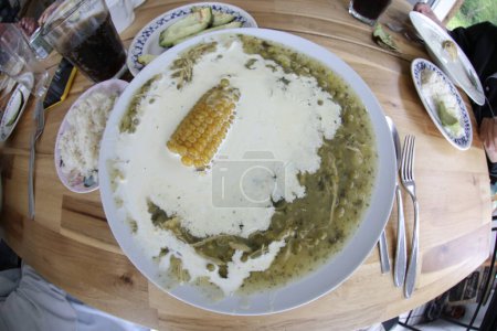 Photo for Wide angle shot of Colombian ajiaco soup in restaurant - Royalty Free Image
