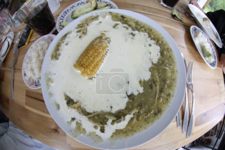 Photo for Wide angle shot of Colombian ajiaco soup in restaurant - Royalty Free Image