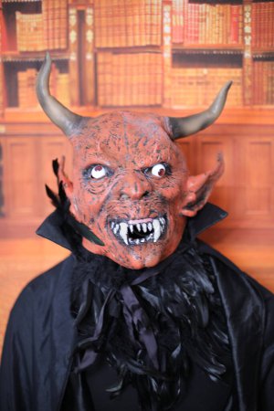 Photo for Close-up portrait of person in devil mask indoor - Royalty Free Image