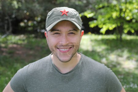 Man wearing revolutionary green hat with red star