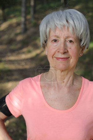 Photo for Healthy looking senior woman in nature - Royalty Free Image