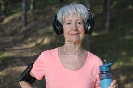Photo for Senior active woman holding water bottle - Royalty Free Image