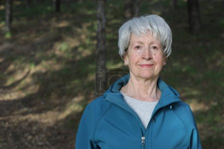 Photo for Healthy looking senior woman in nature - Royalty Free Image