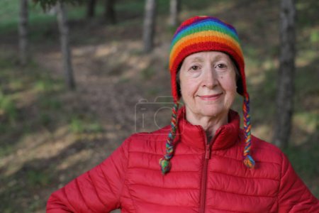 Photo for Mature woman walking in the park during winter time - Royalty Free Image