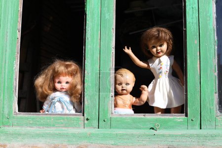 Photo for Spooky dolls in abandoned house on background, close up - Royalty Free Image