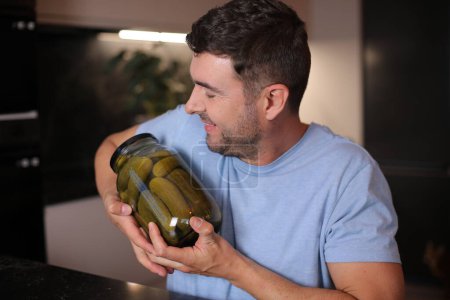 Photo for Man that really loves pickles on background, close up - Royalty Free Image