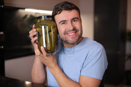 Photo for Man that really loves pickles on background, close up - Royalty Free Image