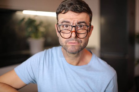 Photo for Man wearing three different types of eyeglasses simultaneously - Royalty Free Image