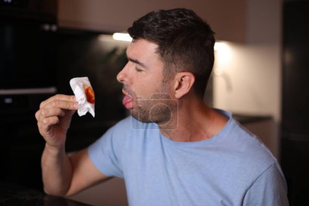 Man coughing saliva with blood on background, close up