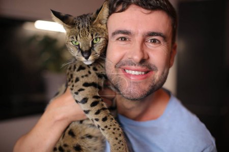 Photo for Exotic cat and his  male owner - Royalty Free Image