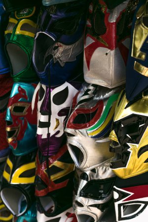 Photo for Colorful masks of different mexican wrestling wrestlers placed in a street stall in mexico city - Royalty Free Image