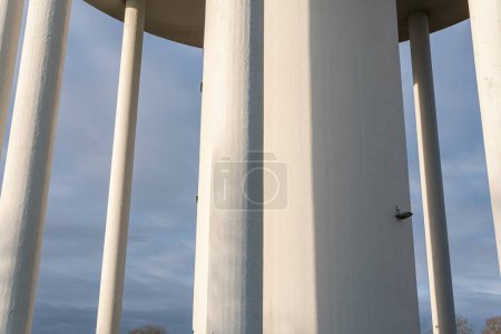 Photo for A big and high water tower from concrete, many columns, architecture - Royalty Free Image