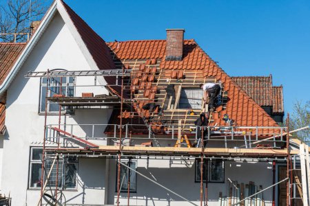 Photo for Sweden, Malmo  May 3, 2023: Replacement and renovation of an old roof on a private house - Royalty Free Image