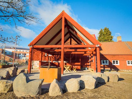 A beautiful and cozy barbeque house, gazebo, pavilion, recreational area with grill. Typical place for relaxing in Sweden from red wood. Warm and sunny spring day. 