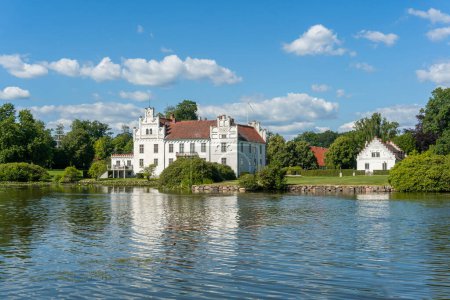 Photo for Sweden, Wanas  July 8, 2023: A beautiful old vintage castle in front of a lake on a sunny summer day - Royalty Free Image