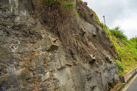 Photo for Rock bolts and Anchors to protect rock slopes from destruction. Protection of the rocky slope from collapse with reinforced concrete anchors - Royalty Free Image