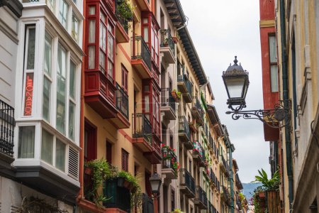 Photo for Bilbao, Basque Country, Spain - 11 06 2022: narrow streets with colorful balconies, Bilbao, Spain - Royalty Free Image