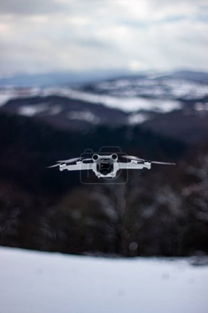 Photo for DJI Mini 3 Pro -  drone photography, helicopter, camera, mountains, ski, air, flying, aerial view - Royalty Free Image