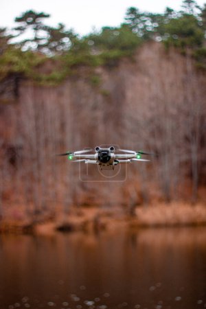 Photo for Drone flying on the river - Royalty Free Image
