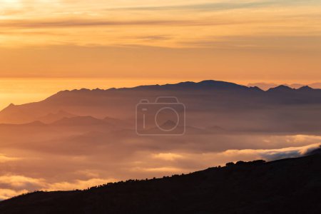 Photo for Landscape of the peaks of the Sierra de Tejeda,Almijara and Alhama between shadows and clouds at sunset seen from Sierra Nevada. - Royalty Free Image