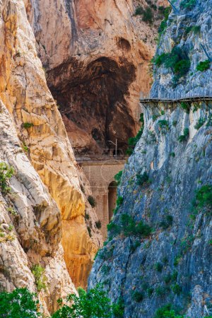 Caminito del Rey in the Gaitanes gorge, view of the new road in a canyon wall and the train tracks excavated in the rock of the opposite wall, Malaga, Andalucia.