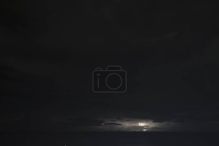 Photo for Nightshot: flashes of lightning in thunderstorm scenery around Curacao, the Caribbean. - Royalty Free Image