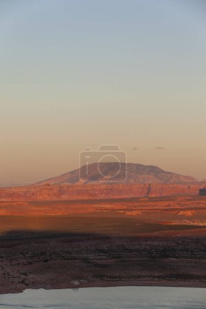 Photo for Spectacular view of rocky formations of Glen Canyon located near river under bright sundown sky in Colorado - Royalty Free Image