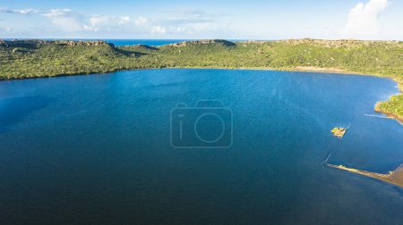 Aerial view above scenery of Curacao, Caribbean with ocean, coast, hills and sky