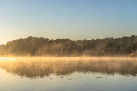 Photo for Beautiful view of a foggy sunrise on the lake - Royalty Free Image