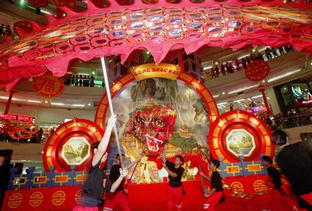 Photo for Attractions Lion Dance in one of the malls in Surabaya to welcome the celebration of Chinese New Year. Photo taken on November 20, 2001 - Royalty Free Image