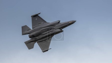 Photo for Fairford, UK - 14th July 2022: A Lockheed Martin F-35 Lightning 2 fighter jet, flying past low in height - Royalty Free Image